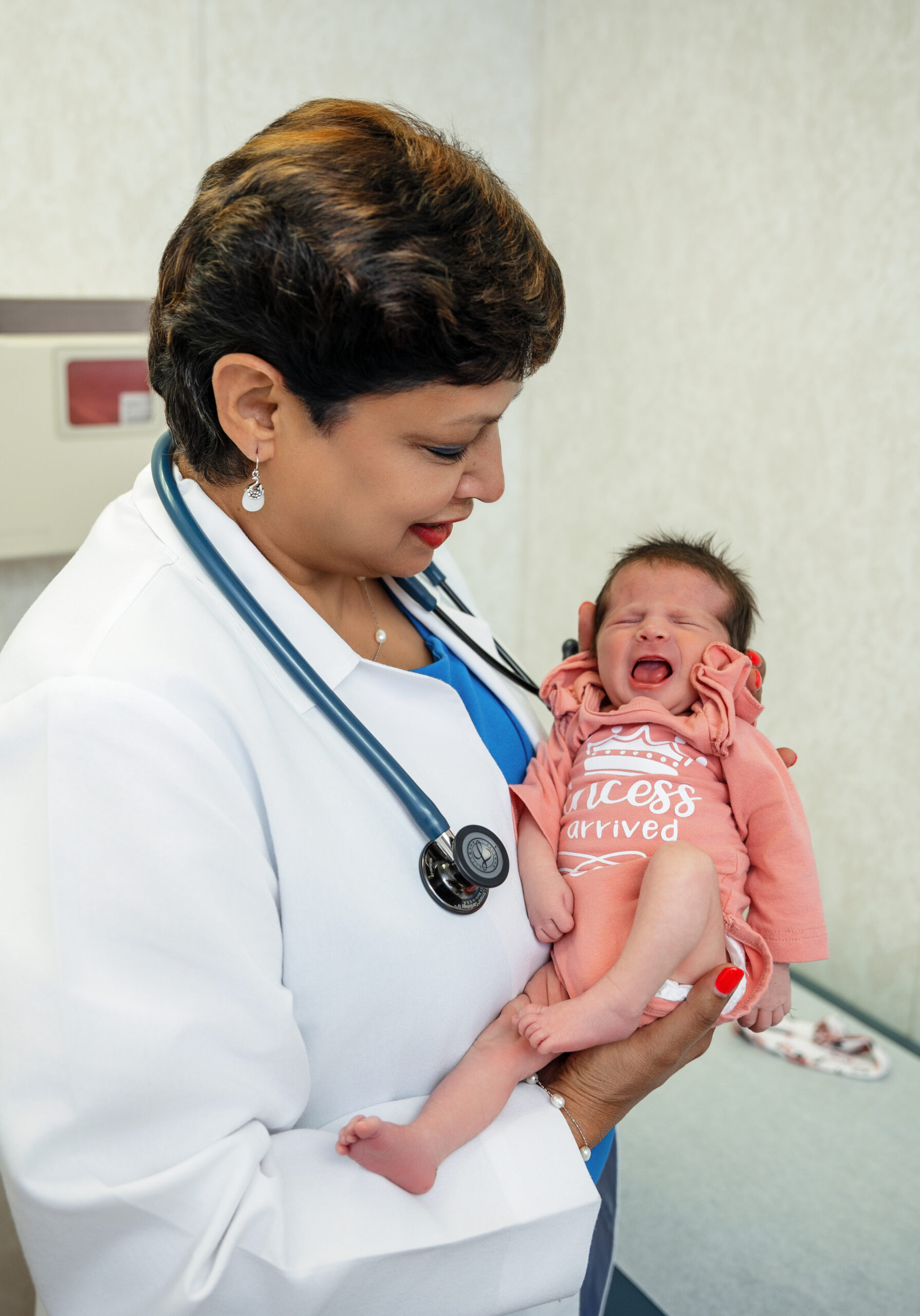 Dr. Chandra with newborn