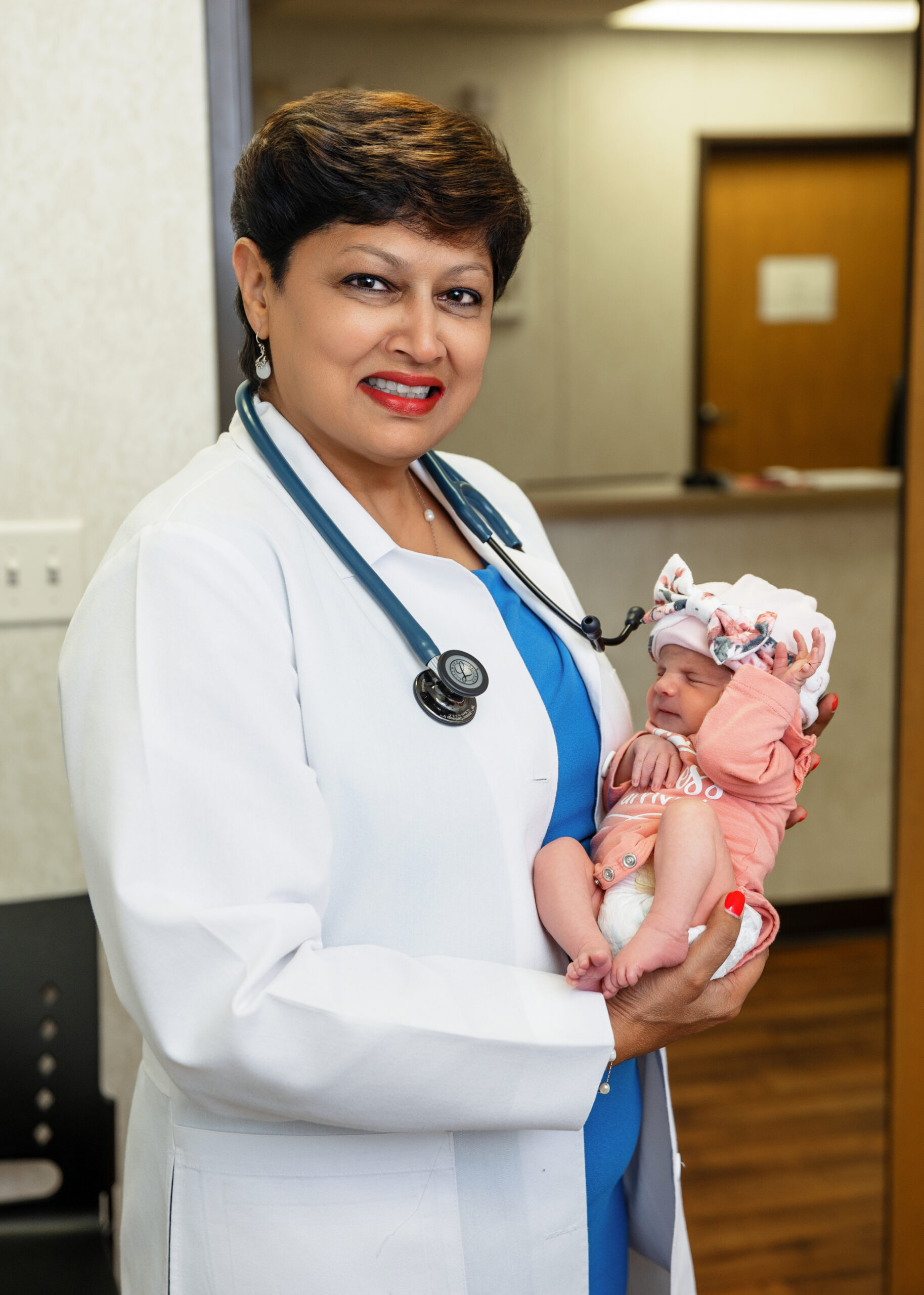 Dr. Chandra with newborn
