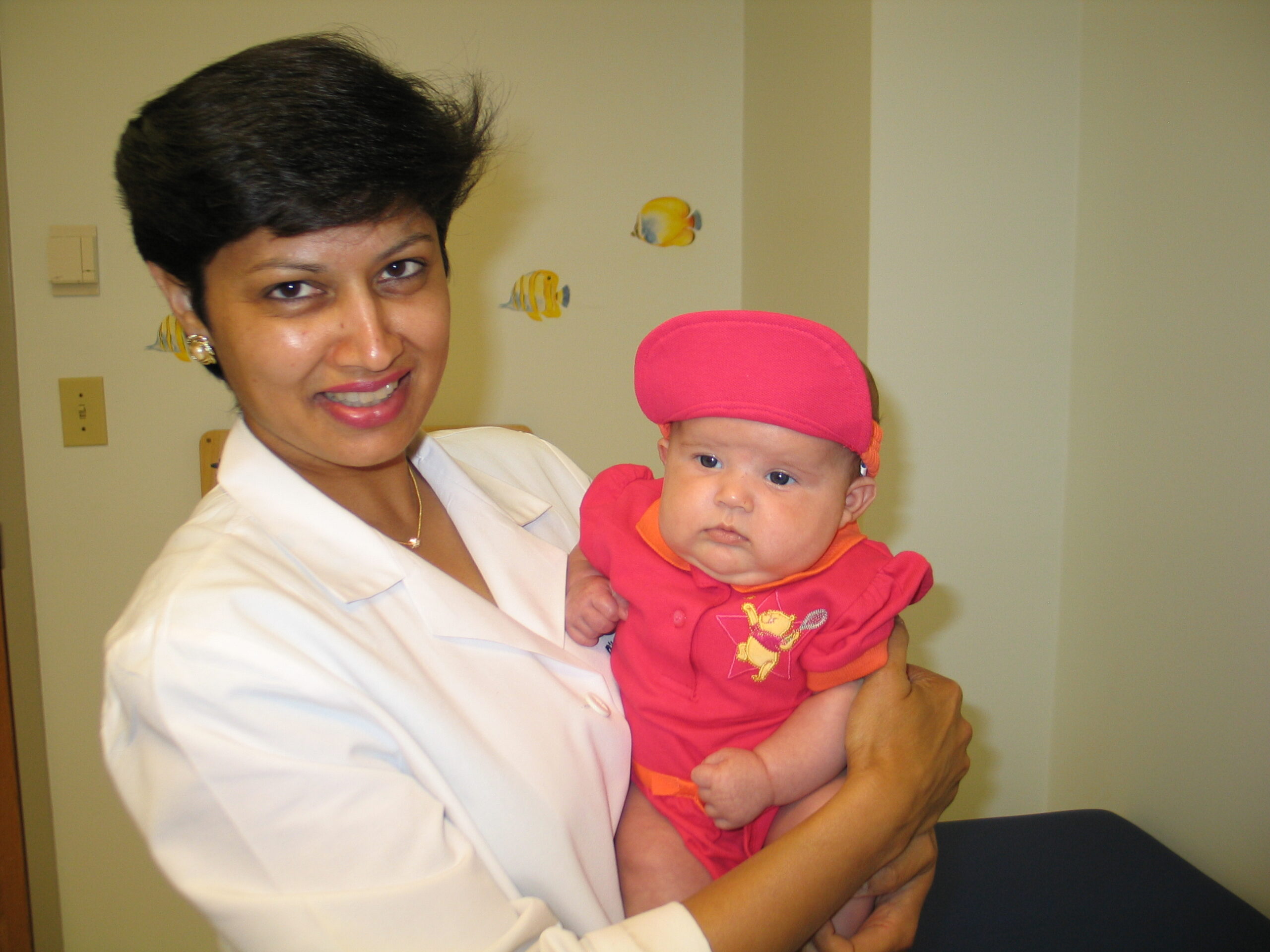 Dr. Chandra caring for a baby