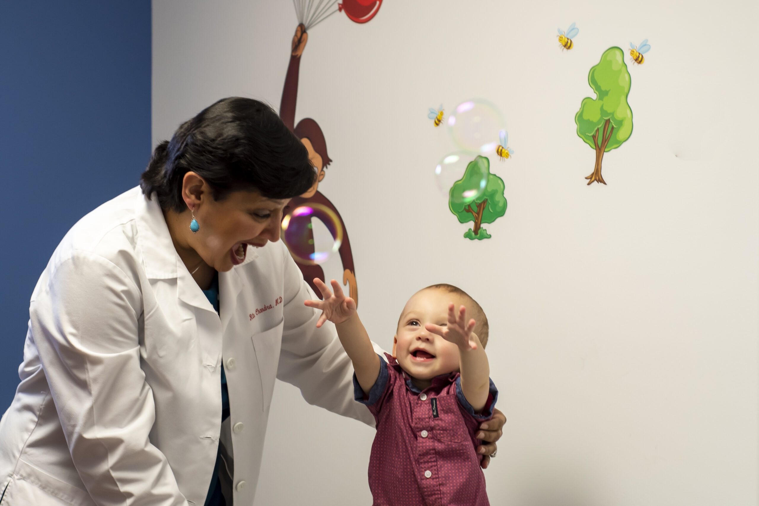 Dr. Chandra with a child patient