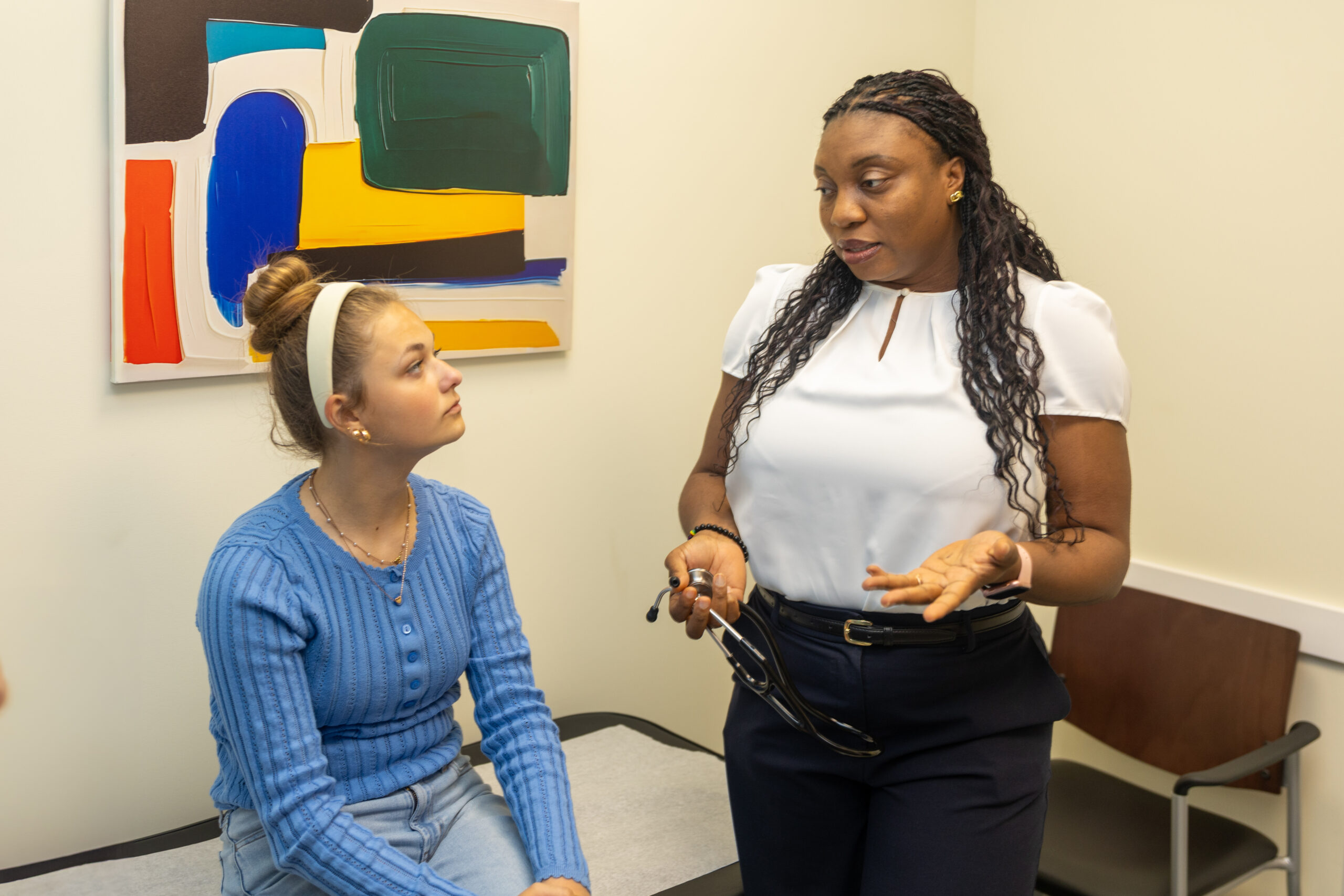 Dr. Obiaigwe with patient